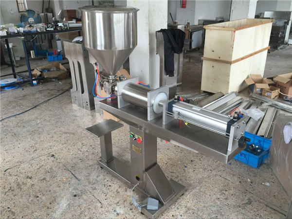 نیم خودکار واحد ہیڈ شہد بھرنے والی مشین۔